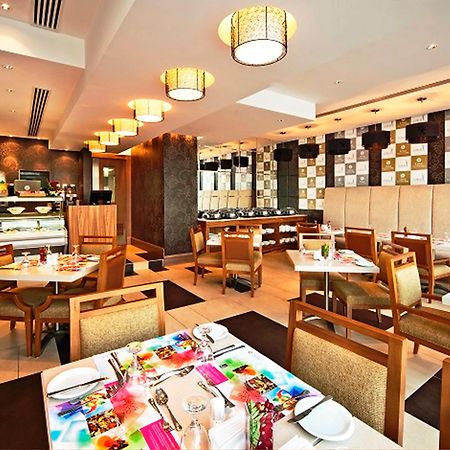 Oaks Liwa Executive Suites Abu Dhabi Restaurante foto